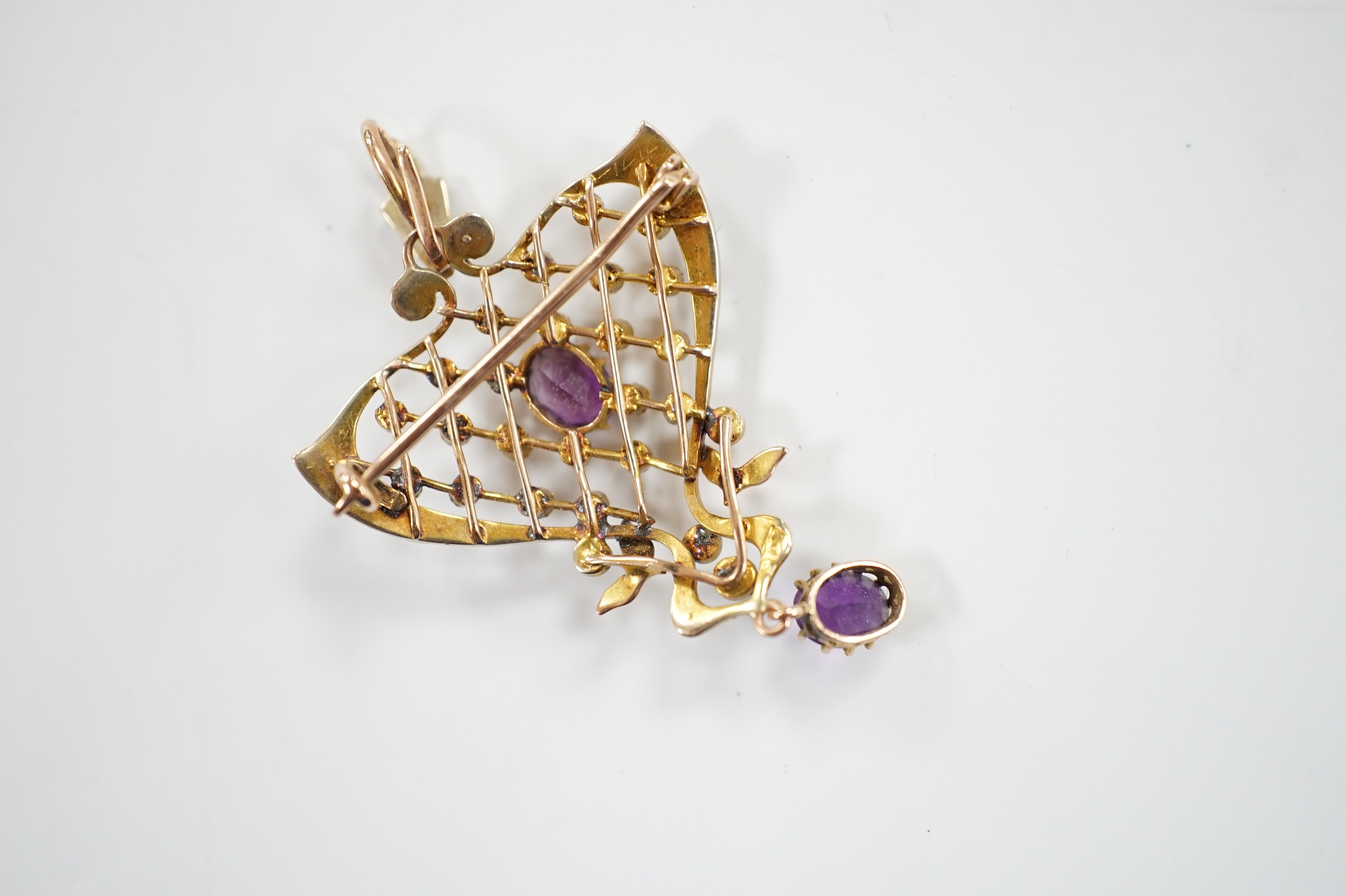 An Edwardian Art Nouveau 9ct, amethyst and seed pearl set drop pendant, 50mm, gross weight 5.2 grams.
